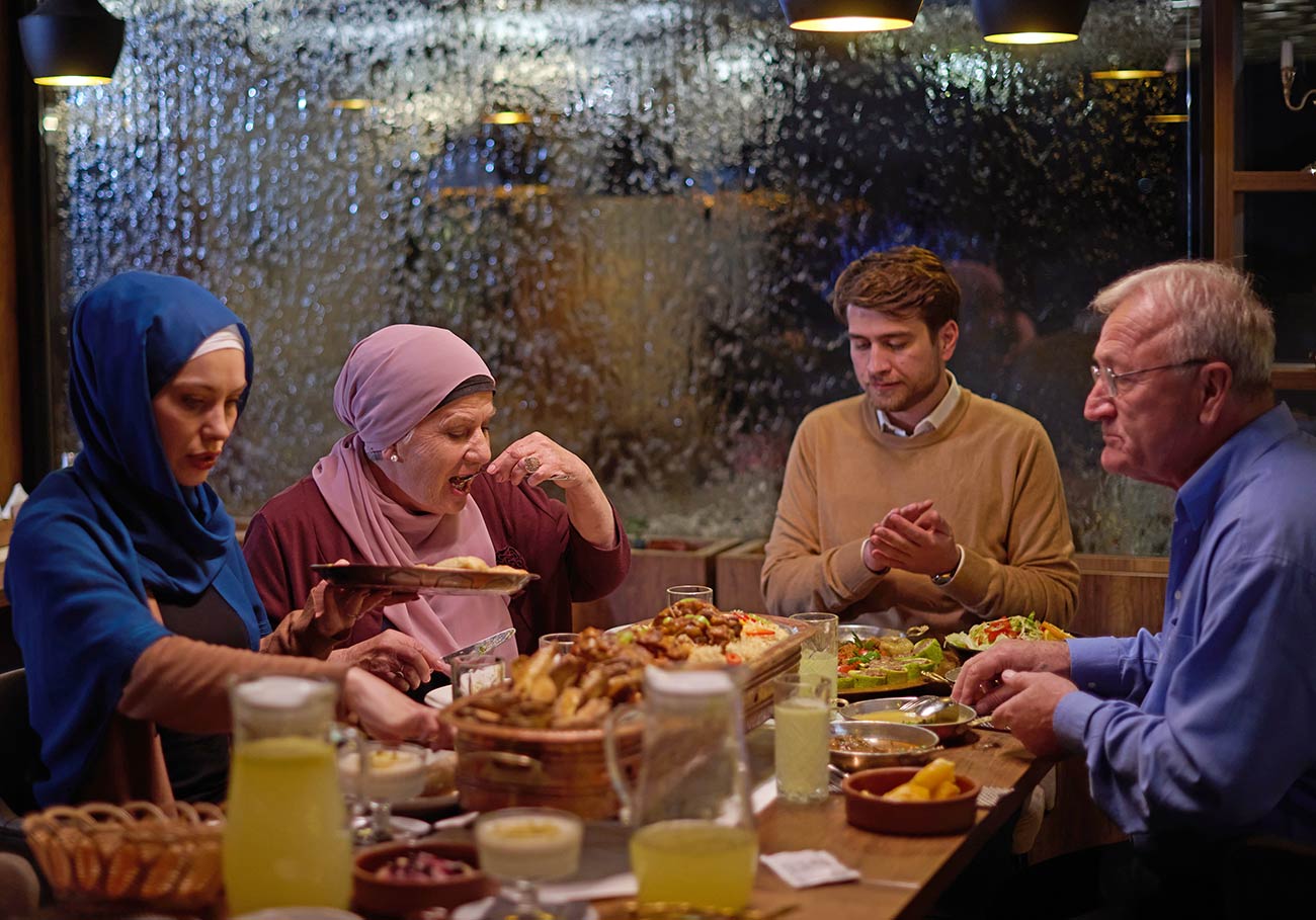 Family Breaking Their Fast at the Table During Ramadan